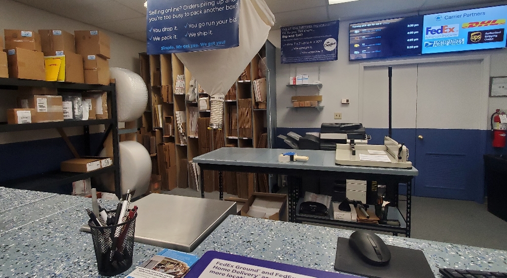 Independent pack and ship store counter with customer-facing shipping information